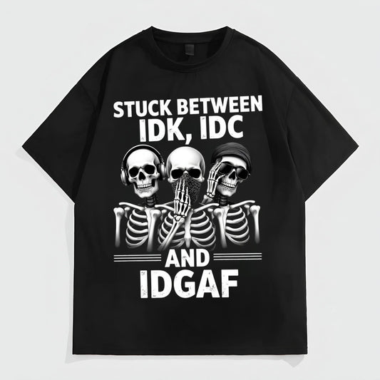 Black Short Sleeve T-Shirt with Skeletons and Text STUCK BETWEEN IDK, IDC AND IDGAF for Casual Wear Trendy Tees Trends